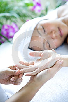 Woman receiving hand massage