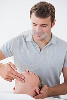 Woman receiving head massage