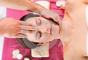 Woman Receiving Head Massage In Beauty Spa