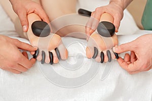 Woman receiving hot stone massage