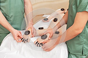 Woman receiving hot stones massage