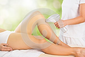 Woman Receiving Laser Epilation Treatment On Legs