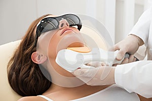 Woman Receiving Laser Hair Removal On Neck