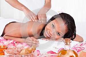 Woman Receiving Massage At Spa