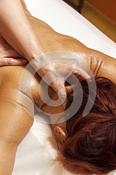 Woman receiving a professional massage and lymphatic drainage -various techniques demonstration