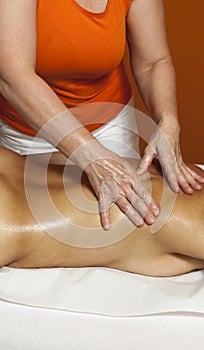 Woman receiving a professional massage and lymphatic drainage -various techniques demonstration