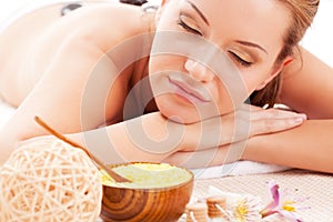 Woman receiving spa stones therapy