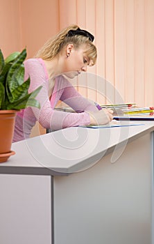 Woman receptionist write a note