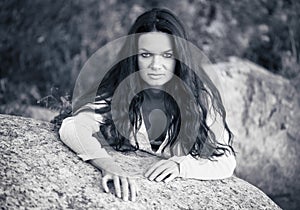 Woman recline on stone photo