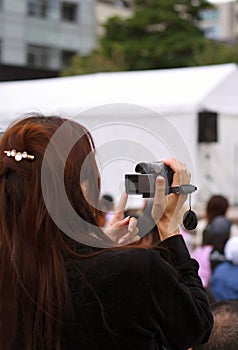 Woman recording an event