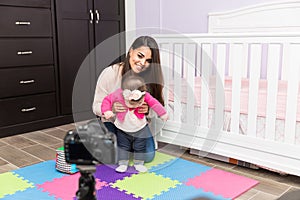 Woman recording parenting video blog