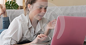 Woman rectifying her mistake using laptop at home