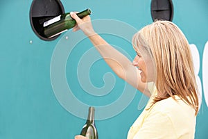 Woman At Recycling Centre At Bottle Bank