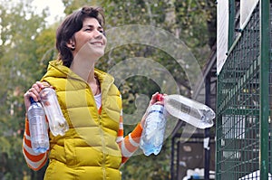 Woman recycling garbage