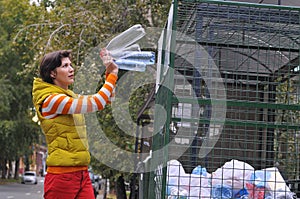 Woman recycling garbage