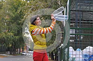 Woman recycling garbage