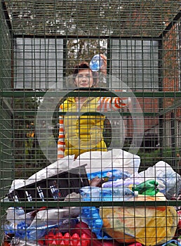 Woman recycling garbage