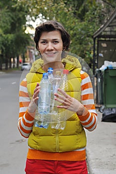 Woman recycling garbage