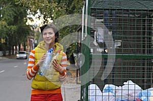 Woman recycling garbage