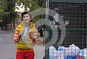 Woman recycling garbage