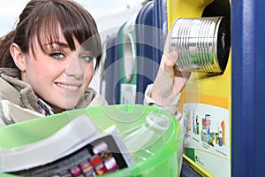 Woman recycling household waste