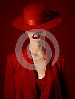 Woman, red aesthetic and makeup with hat, art and teeth out for couture, emoji and studio background. Girl, model and