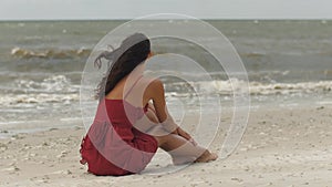 Woman in a Red on the Beach, Cold Windy Weather