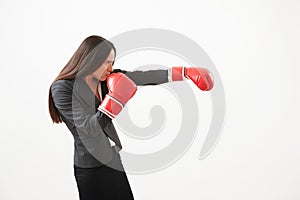 Woman in red boxing gloves punching