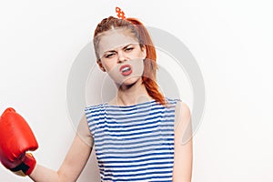 woman in red boxing gloves and striped t-shirt front view