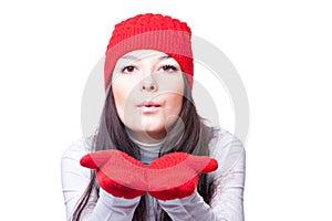 Woman in red cap blows
