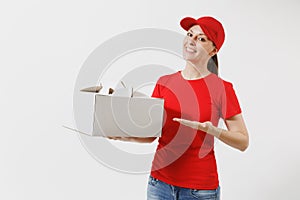 Woman in red cap, t-shirt giving food order cake box isolated on white background. Female courier holding dessert in