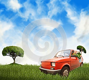 Una mujer en auto sobre el prado 