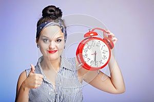 Woman with red clock. Time management concept.