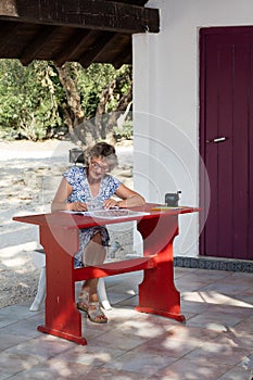 Woman at red desk