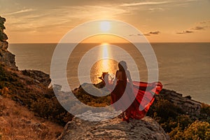 Woman in red dress, fashion model in evening dress, soaring in the street, sunset