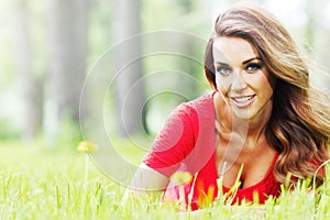 Woman in red dress on grass