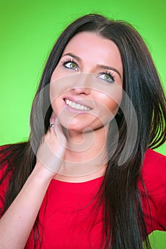 Woman in red dress on green background