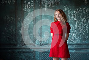 woman in red dress holding red rose