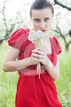 Woman in red dress with posy