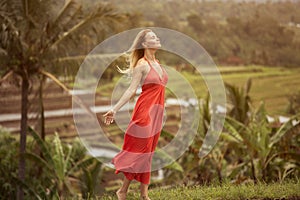 Woman in red dress. Rice terraces.