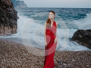 woman in red dress shore oceans posing fashion silhouette