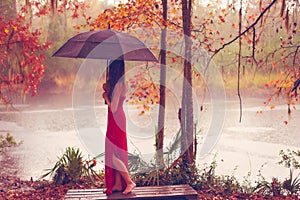 Woman in red dress with umbrella