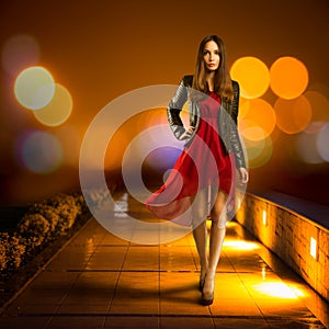 Woman in Red Dress Walking. Night City
