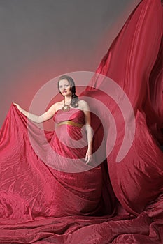 Woman in red flying dress