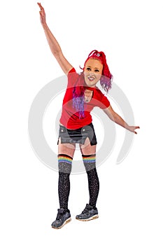 Woman with red hair and red shirt balances