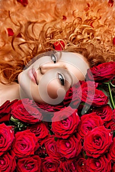 Woman with red hair and roses