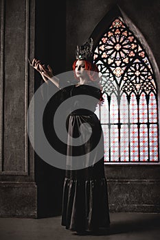 Woman with red hair in royal garb photo