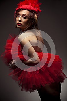 woman in red hat with net veil