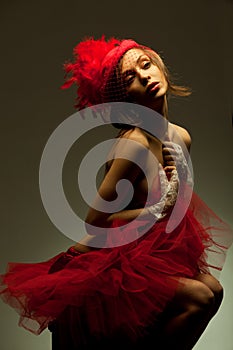 woman in red hat with net veil