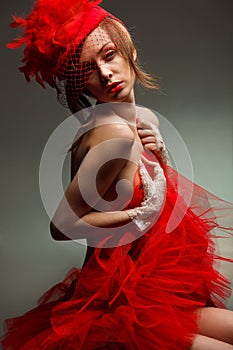 woman in red hat with net veil